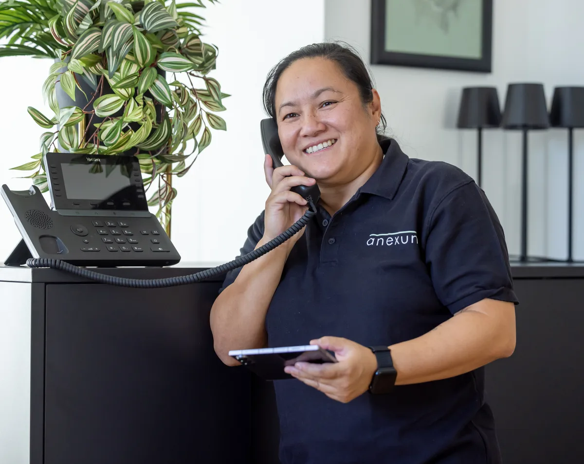 An Anexum colleague on the phone